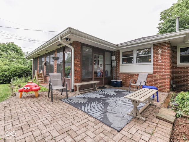 1504 Mcclure Rd, Columbus, IN 47201 - view of patio / terrace featuring a sunroom