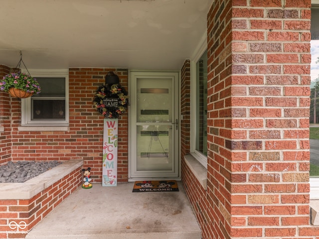 1504 Mcclure Rd, Columbus, IN 47201 - property entrance with brick siding and covered porch