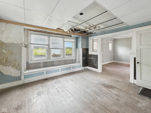 4709 E New York St, Indianapolis, IN 46201 - unfurnished living room featuring wood finished floors and baseboards