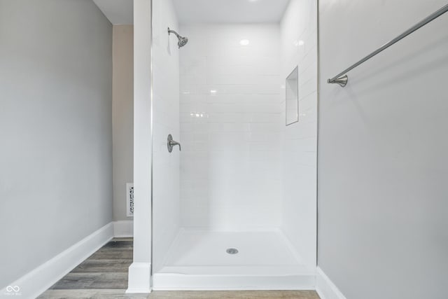 2896 Sutherland Ave, Indianapolis, IN 46205 - full bath featuring a tile shower, wood finished floors, and baseboards