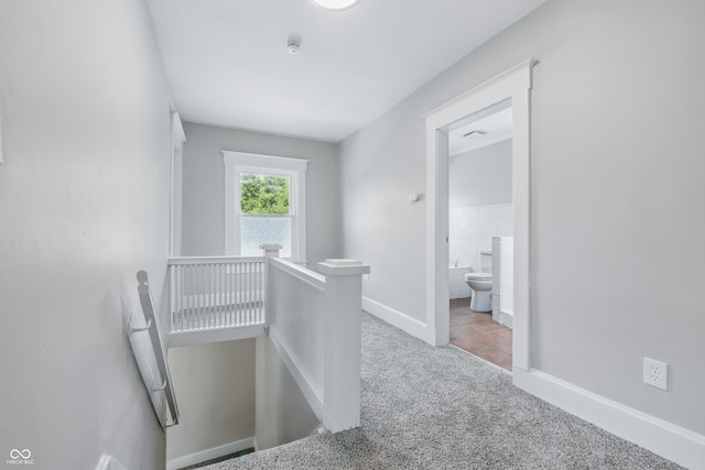 2896 Sutherland Ave, Indianapolis, IN 46205 - corridor featuring an upstairs landing, carpet flooring, and baseboards