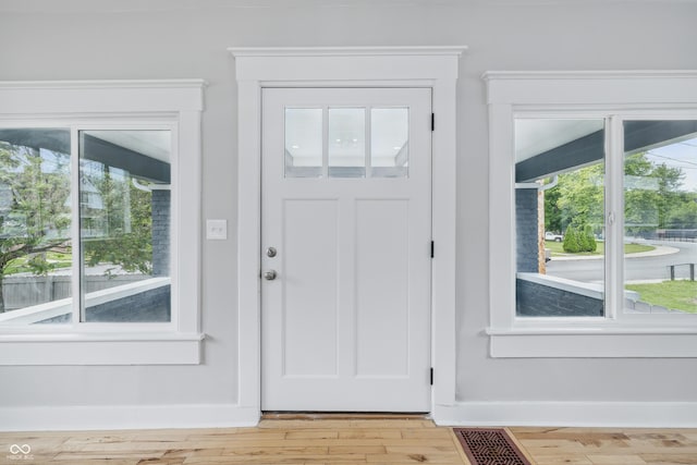 2896 Sutherland Ave, Indianapolis, IN 46205 - entryway with light wood-style floors, plenty of natural light, and baseboards