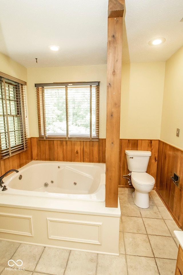5530 Shawnee Trail S Drive, Indianapolis, IN 46220 - full bathroom featuring wainscoting, a jetted tub, wooden walls, and vanity