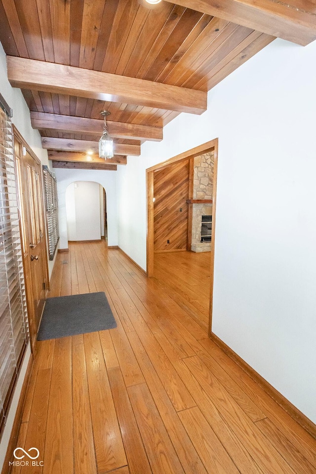 5530 Shawnee Trail S Drive, Indianapolis, IN 46220 - corridor with arched walkways, light wood-style floors, and a wooden ceiling with exposed beams