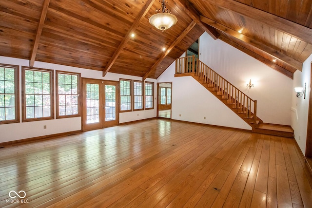 5530 Shawnee Trail S Drive, Indianapolis, IN 46220 - unfurnished living room with a wooden ceiling with exposed beams, stairway, light wood-style floors, french doors, and high vaulted ceiling