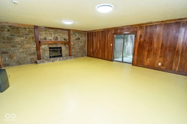 5530 Shawnee Trail S Drive, Indianapolis, IN 46220 - unfurnished living room featuring a stone fireplace and wooden walls
