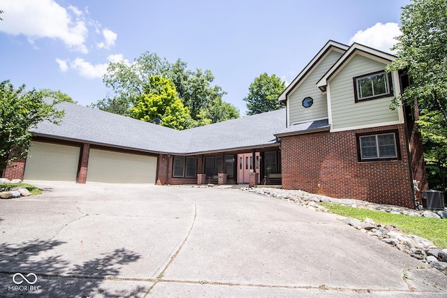 5530 Shawnee Trail S Drive, Indianapolis, IN 46220 - traditional home featuring brick siding, a garage, concrete driveway, and roof with shingles