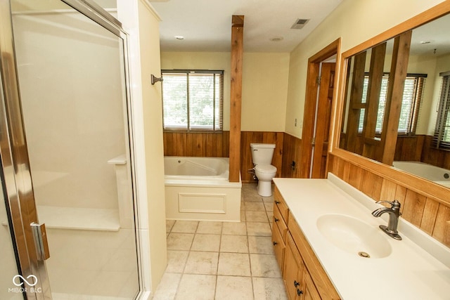5530 Shawnee Trail S Drive, Indianapolis, IN 46220 - full bathroom with vanity, a bath, a shower stall, a wainscoted wall, and wooden walls