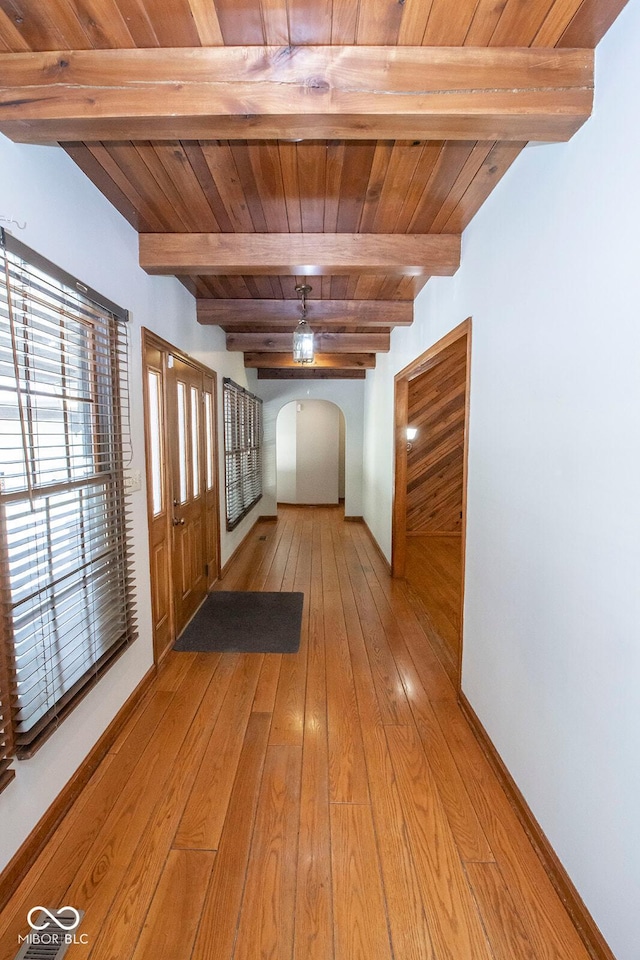 5530 Shawnee Trail S Drive, Indianapolis, IN 46220 - hallway with a wooden ceiling with exposed beams, light wood-style floors, and arched walkways
