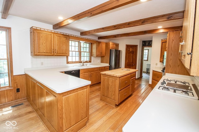 5530 Shawnee Trail S Drive, Indianapolis, IN 46220 - kitchen featuring white gas cooktop, beamed ceiling, light wood-style flooring, wood counters, and a wainscoted wall
