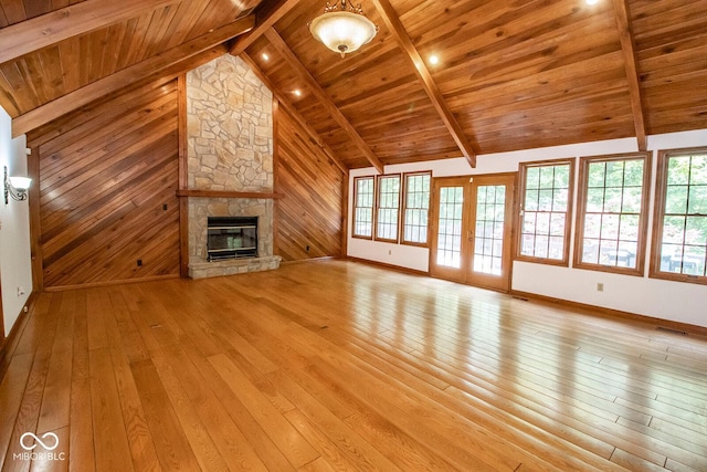 5530 Shawnee Trail S Drive, Indianapolis, IN 46220 - unfurnished living room with wooden ceiling, light wood finished floors, a fireplace, french doors, and wooden walls