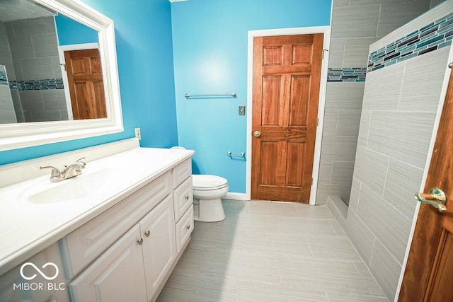 5109 N Weathers Ct, Bloomington, IN 47404 - full bathroom featuring vanity, tiled shower, and tile patterned flooring