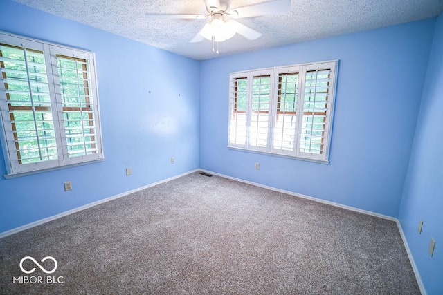5109 N Weathers Ct, Bloomington, IN 47404 - spare room featuring a textured ceiling, ceiling fan, and carpet