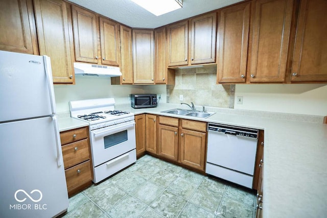 5109 N Weathers Ct, Bloomington, IN 47404 - kitchen featuring white appliances, under cabinet range hood, light countertops, and brown cabinets