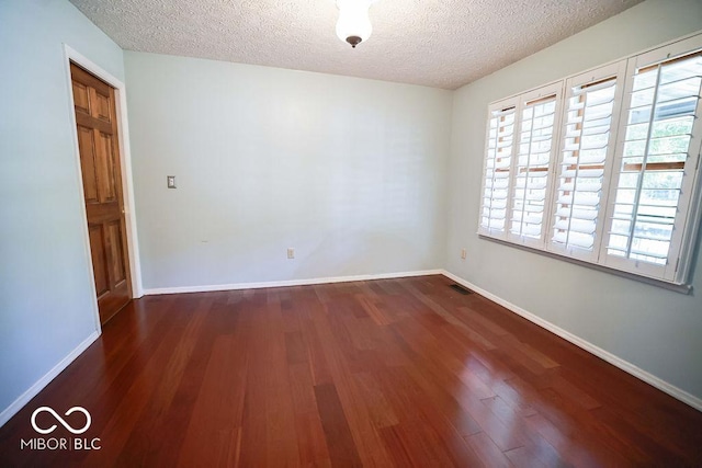 5109 N Weathers Ct, Bloomington, IN 47404 - spare room featuring a textured ceiling and wood finished floors