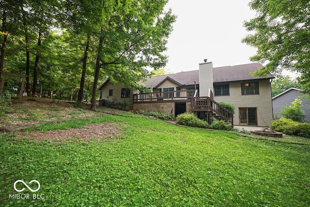 5109 N Weathers Ct, Bloomington, IN 47404 - rear view of house with stairs, a deck, a chimney, and a lawn
