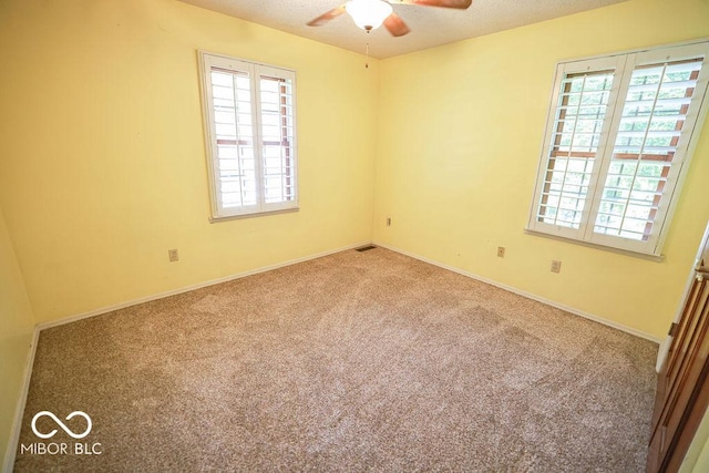 5109 N Weathers Ct, Bloomington, IN 47404 - spare room featuring carpet flooring and ceiling fan