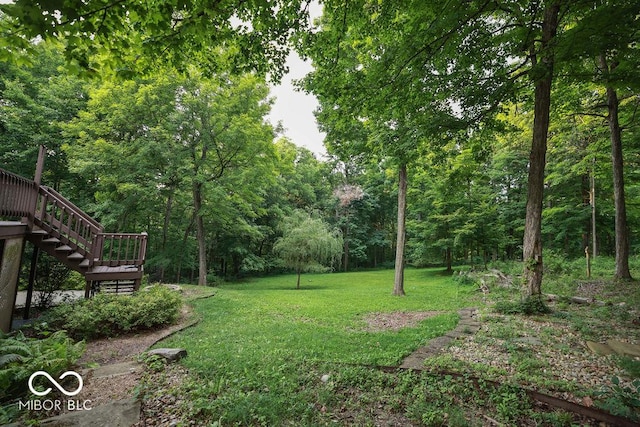 5109 N Weathers Ct, Bloomington, IN 47404 - view of grassy yard featuring stairway and a forest view