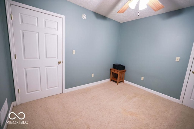 5109 N Weathers Ct, Bloomington, IN 47404 - empty room with carpet, a ceiling fan, a textured ceiling, and a smoke detector