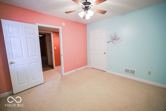 5109 N Weathers Ct, Bloomington, IN 47404 - unfurnished bedroom with light carpet, a textured ceiling, and a ceiling fan