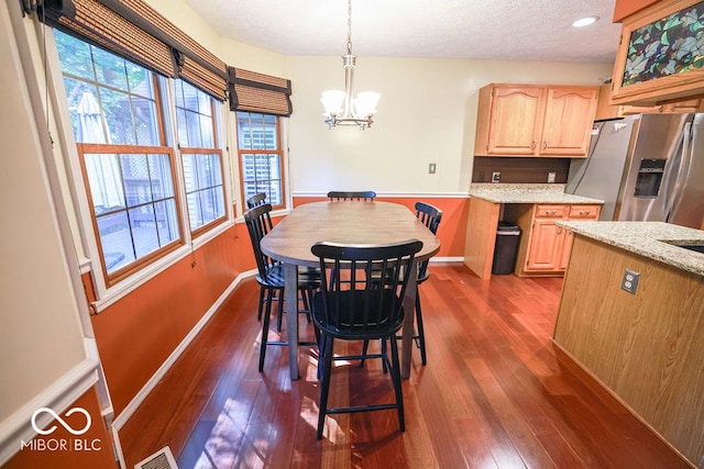 5109 N Weathers Ct, Bloomington, IN 47404 - dining area featuring a chandelier, dark wood-style flooring, and a textured ceiling
