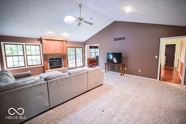 5109 N Weathers Ct, Bloomington, IN 47404 - living room with lofted ceiling, a ceiling fan, carpet, a brick fireplace, and healthy amount of natural light