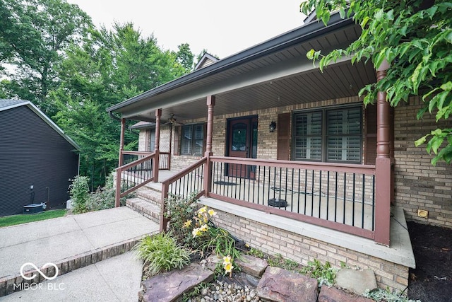 5109 N Weathers Ct, Bloomington, IN 47404 - view of front of home featuring brick siding and a porch