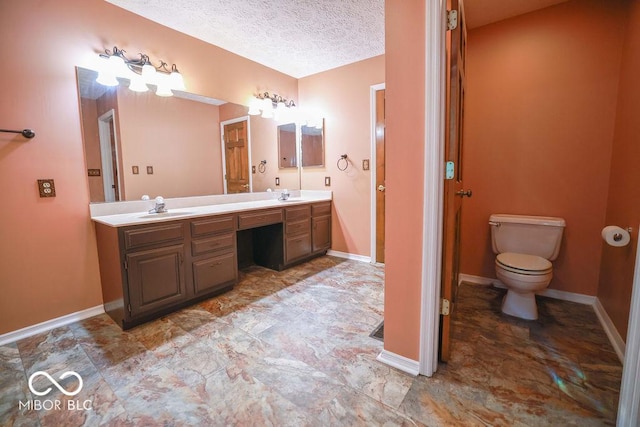 5109 N Weathers Ct, Bloomington, IN 47404 - bathroom with double vanity and a textured ceiling