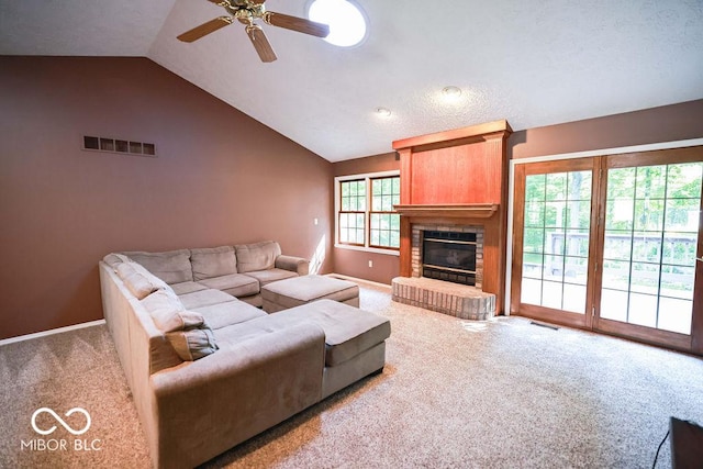 5109 N Weathers Ct, Bloomington, IN 47404 - living room featuring carpet, lofted ceiling, ceiling fan, and a fireplace