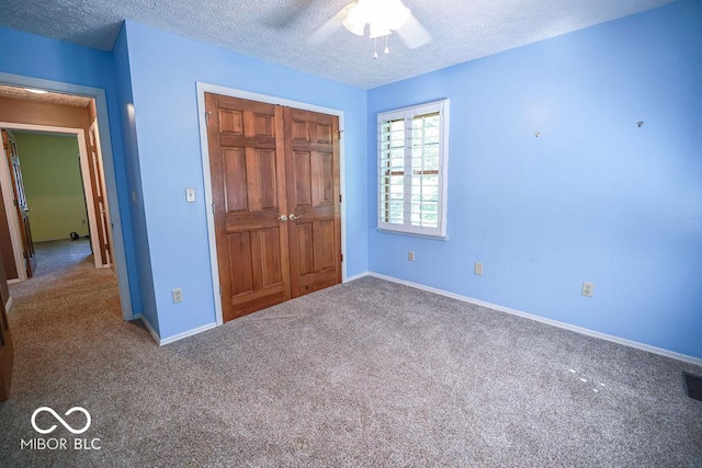 5109 N Weathers Ct, Bloomington, IN 47404 - unfurnished bedroom with carpet flooring, a closet, a textured ceiling, and a ceiling fan
