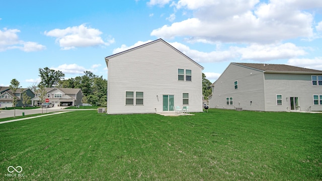 8690 Lester Pl, Pendleton, IN 46064 - back of house featuring a lawn and a patio