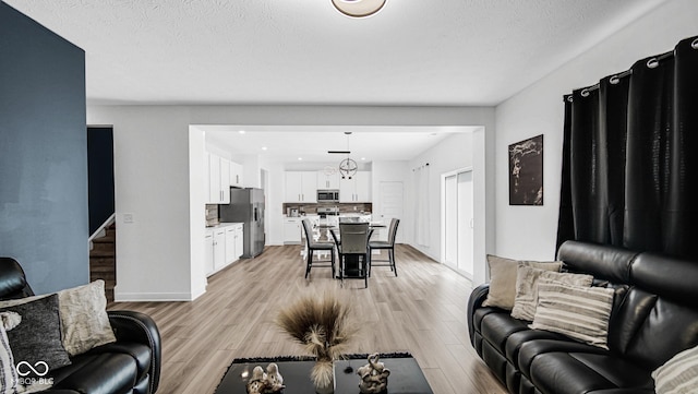 8690 Lester Pl, Pendleton, IN 46064 - living room featuring light wood-style flooring and baseboards
