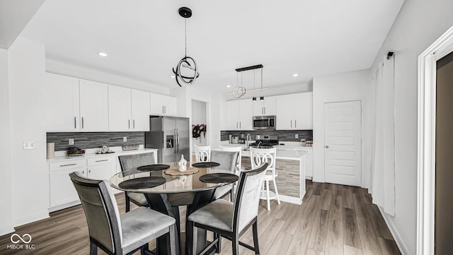 8690 Lester Pl, Pendleton, IN 46064 - dining room featuring recessed lighting and wood finished floors