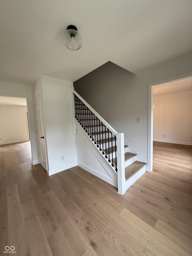 9205 Selkirk Ct, Indianapolis, IN 46260 - stairway featuring wood finished floors and baseboards