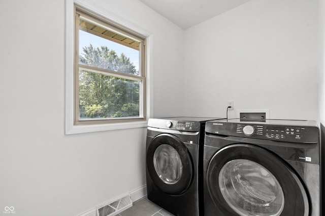 9205 Selkirk Ct, Indianapolis, IN 46260 - washroom with washer and clothes dryer and baseboards
