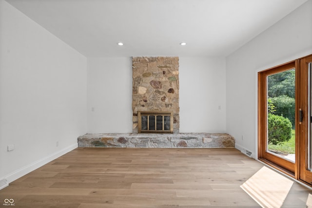 9205 Selkirk Ct, Indianapolis, IN 46260 - unfurnished living room with wood finished floors, a fireplace, and recessed lighting