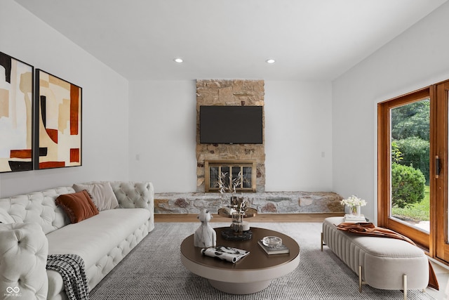 9205 Selkirk Ct, Indianapolis, IN 46260 - living area with healthy amount of natural light, recessed lighting, and a stone fireplace