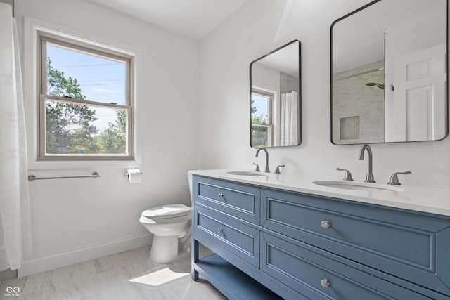 9205 Selkirk Ct, Indianapolis, IN 46260 - full bathroom featuring double vanity, healthy amount of natural light, and a shower