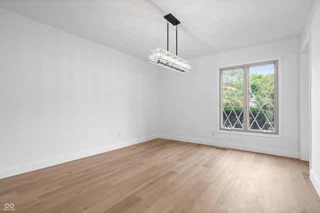 9205 Selkirk Ct, Indianapolis, IN 46260 - unfurnished dining area featuring light wood-style floors and baseboards