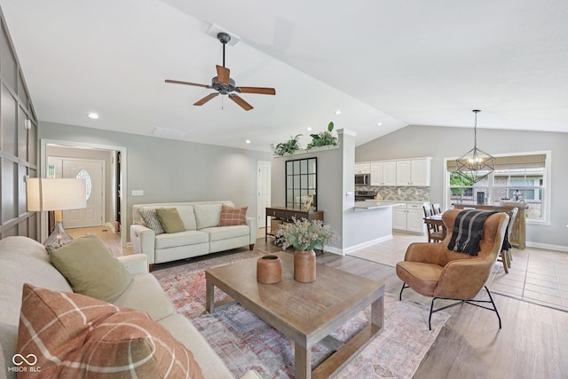 3571 S Cedar Creek Ln, New Palestine, IN 46163 - living area featuring lofted ceiling, a ceiling fan, light wood finished floors, and recessed lighting