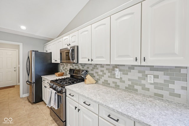3571 S Cedar Creek Ln, New Palestine, IN 46163 - kitchen featuring stainless steel appliances, tasteful backsplash, white cabinets, light tile patterned floors, and recessed lighting