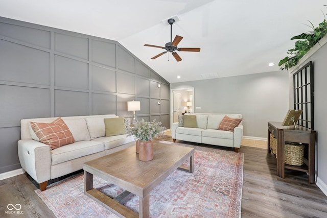 3571 S Cedar Creek Ln, New Palestine, IN 46163 - living area with ceiling fan, lofted ceiling, wood finished floors, and a decorative wall