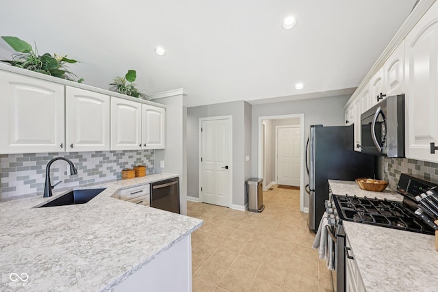 3571 S Cedar Creek Ln, New Palestine, IN 46163 - kitchen with stainless steel appliances, white cabinetry, tasteful backsplash, light tile patterned floors, and recessed lighting