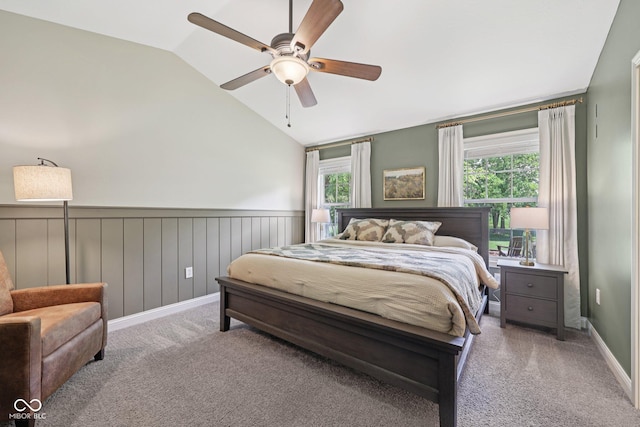 3571 S Cedar Creek Ln, New Palestine, IN 46163 - bedroom featuring wainscoting, multiple windows, vaulted ceiling, carpet flooring, and ceiling fan