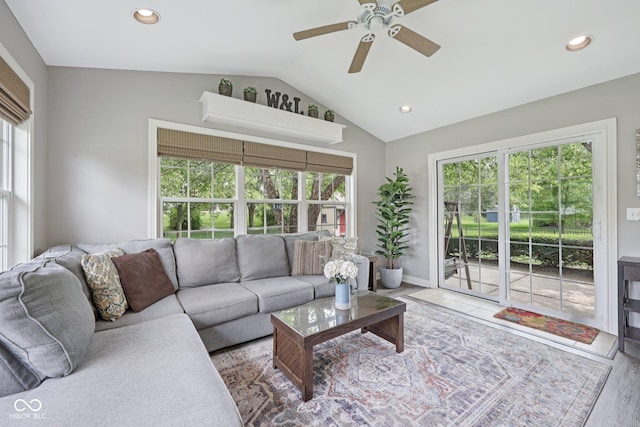 3571 S Cedar Creek Ln, New Palestine, IN 46163 - living room with vaulted ceiling, plenty of natural light, a ceiling fan, recessed lighting, and wood finished floors