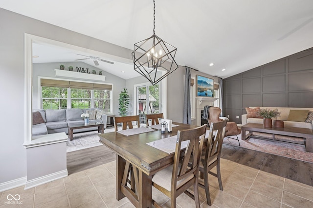 3571 S Cedar Creek Ln, New Palestine, IN 46163 - dining space featuring vaulted ceiling, ceiling fan, light tile patterned floors, a chandelier, and recessed lighting