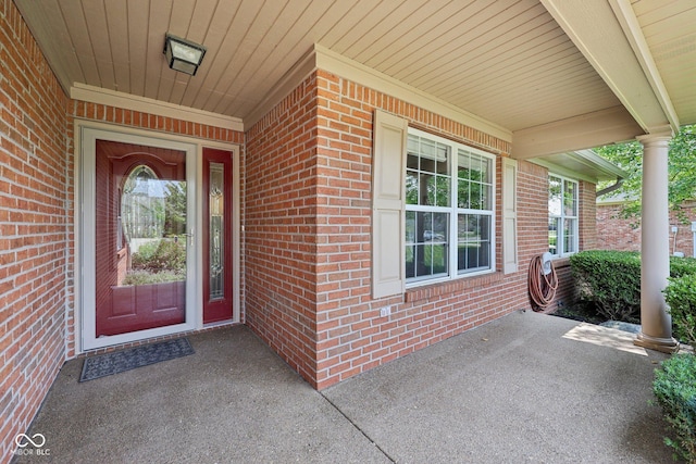 3571 S Cedar Creek Ln, New Palestine, IN 46163 - property entrance with a porch and brick siding