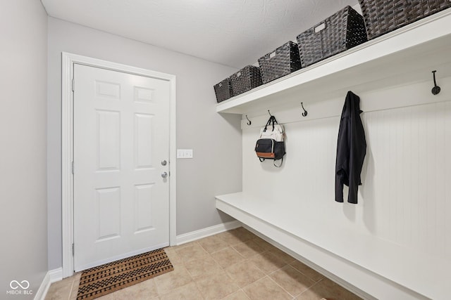 3571 S Cedar Creek Ln, New Palestine, IN 46163 - mudroom featuring light tile patterned flooring and baseboards