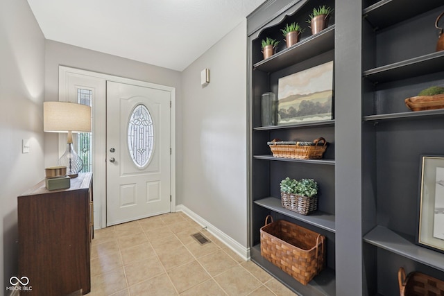 3571 S Cedar Creek Ln, New Palestine, IN 46163 - foyer with light tile patterned floors and baseboards