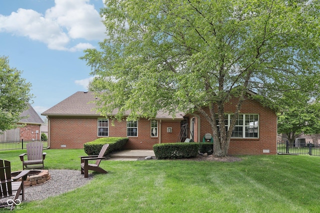 3571 S Cedar Creek Ln, New Palestine, IN 46163 - back of property featuring an outdoor fire pit, brick siding, and a patio